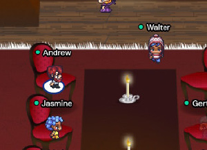 A screenshot showing a group of people networking at a large table in Gather.